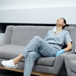 photo of woman resting on the couch