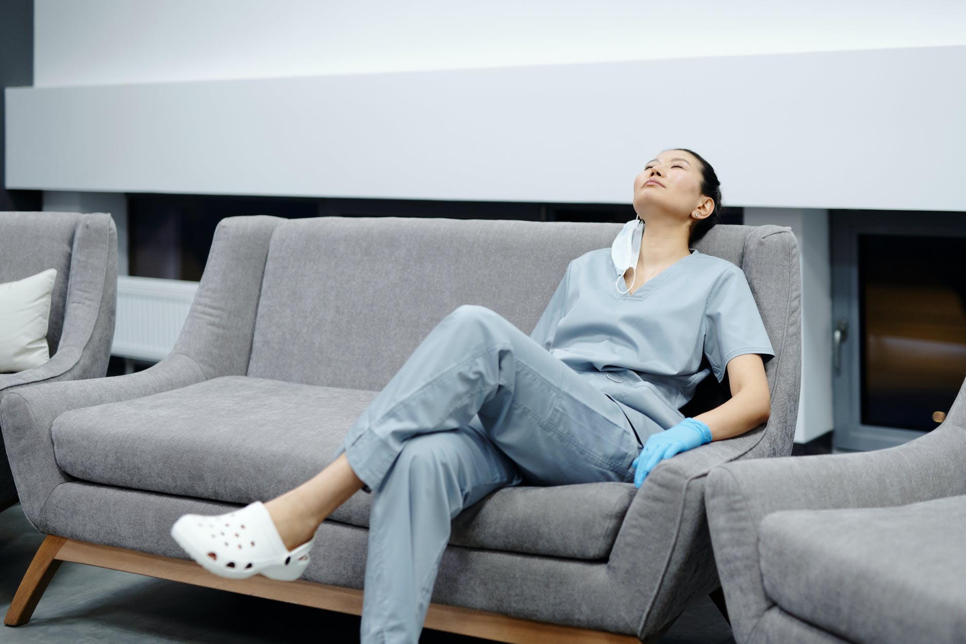 photo of woman resting on the couch