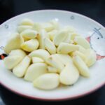 garlic in white ceramic plate