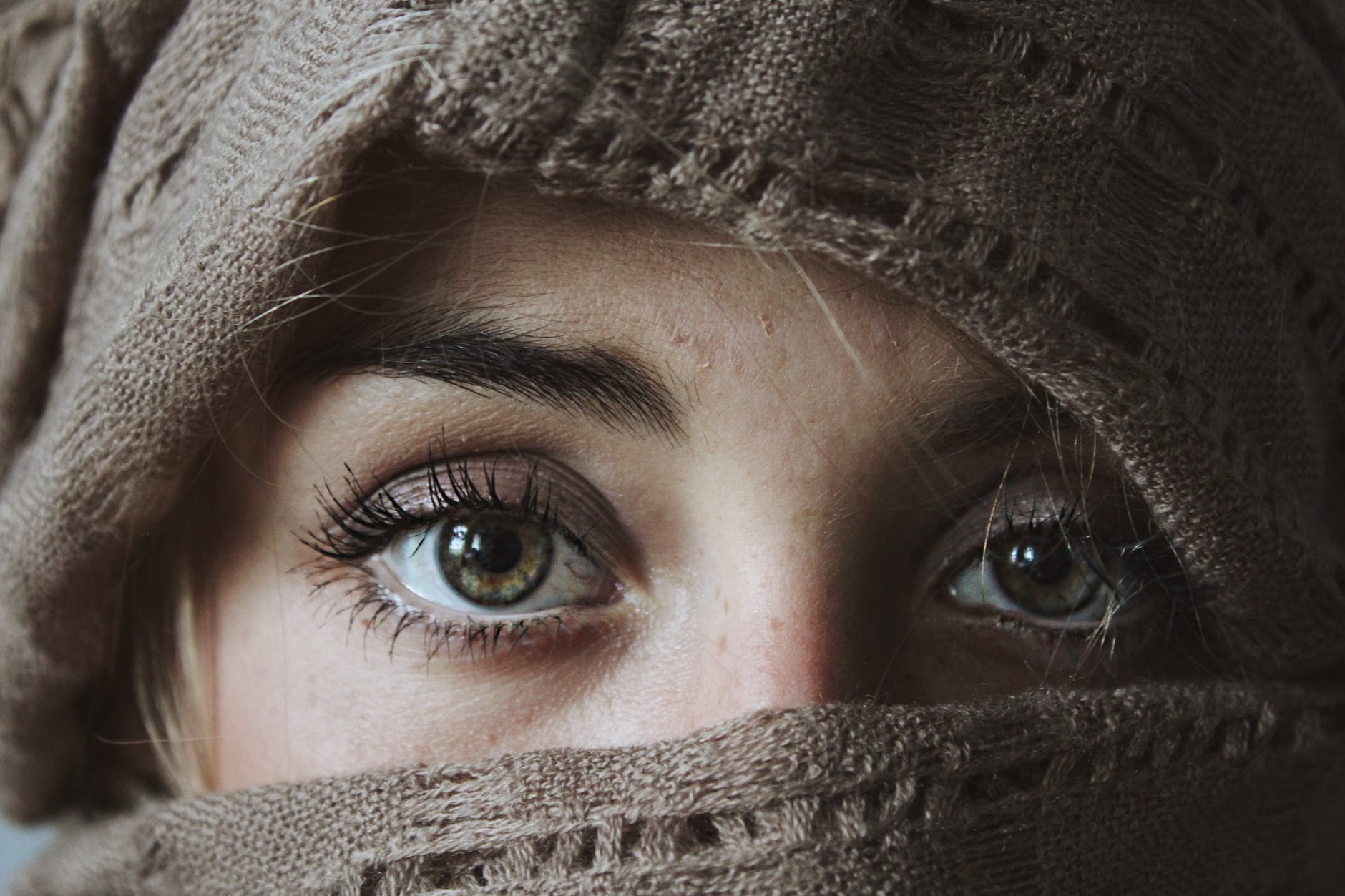 photo of person covered with brown textile